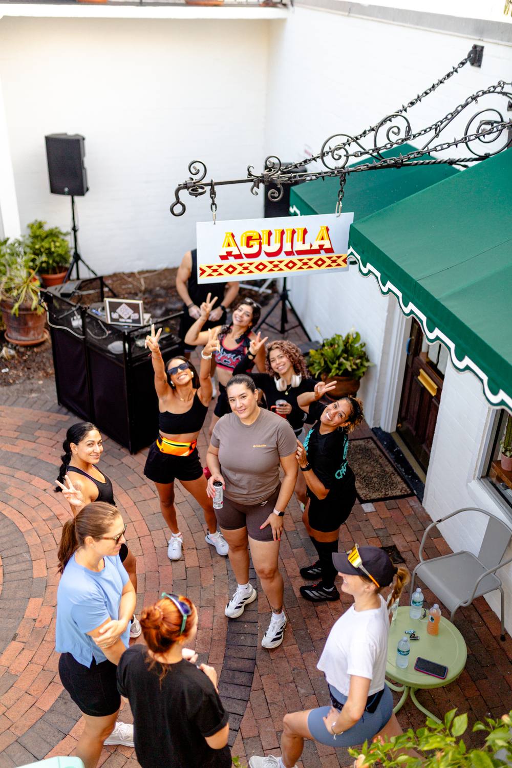 Chosen Few Run Club members gathered in a brick courtyard